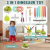 Hengrongshen 3 in 1 Musical Jump Toy für Kinder, zeigt einen Jungen, der auf einem Dinosaurier-Spielzeug springt, umgeben von bunten Spielteilen wie Ringen und Raketen.